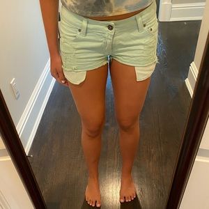 Carmar denim shorts in light sea foam green.